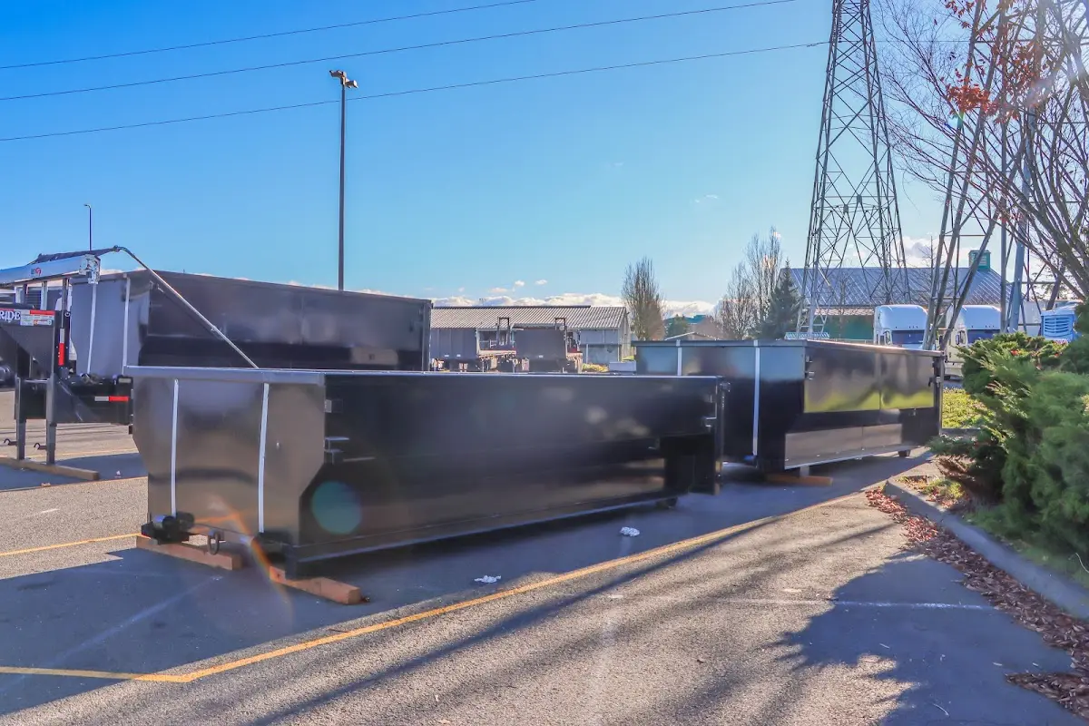 Roll-off dumpster ready for waste disposal at job site for Concrete Dumpster Rental in Grafton